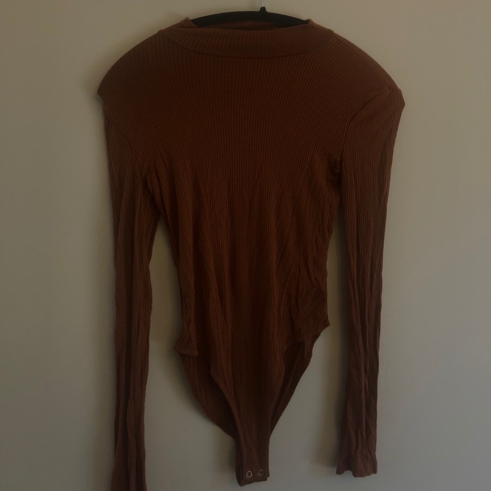 Orange long sleeved light weight body suit